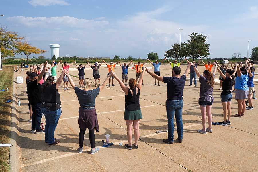 Volunteers participating in an outdoor team-building activity